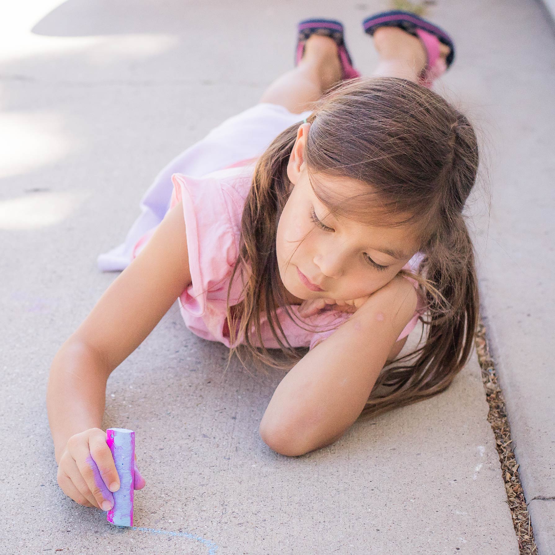 Photograph of young girl with chalk