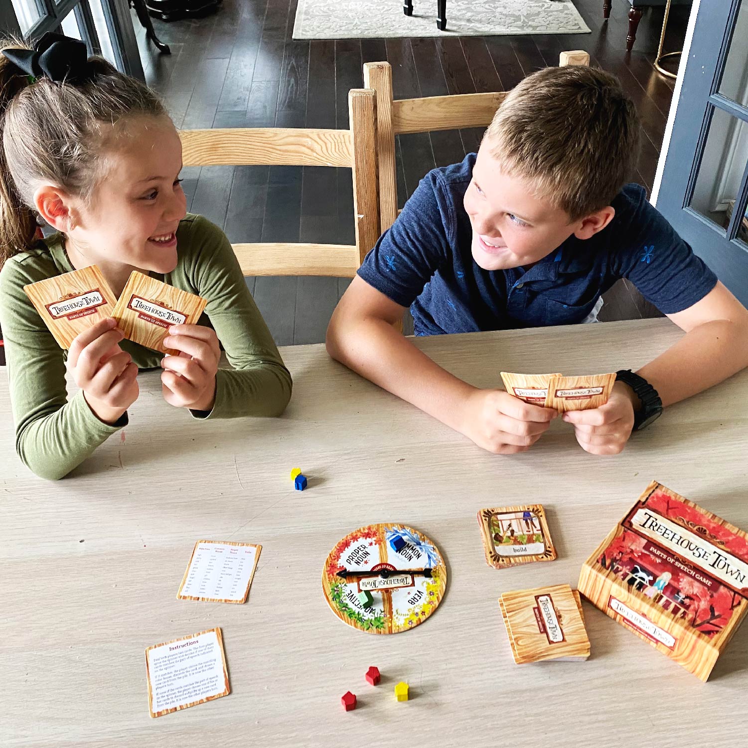 Photograph of Two Children Playing Treehouse Town Game