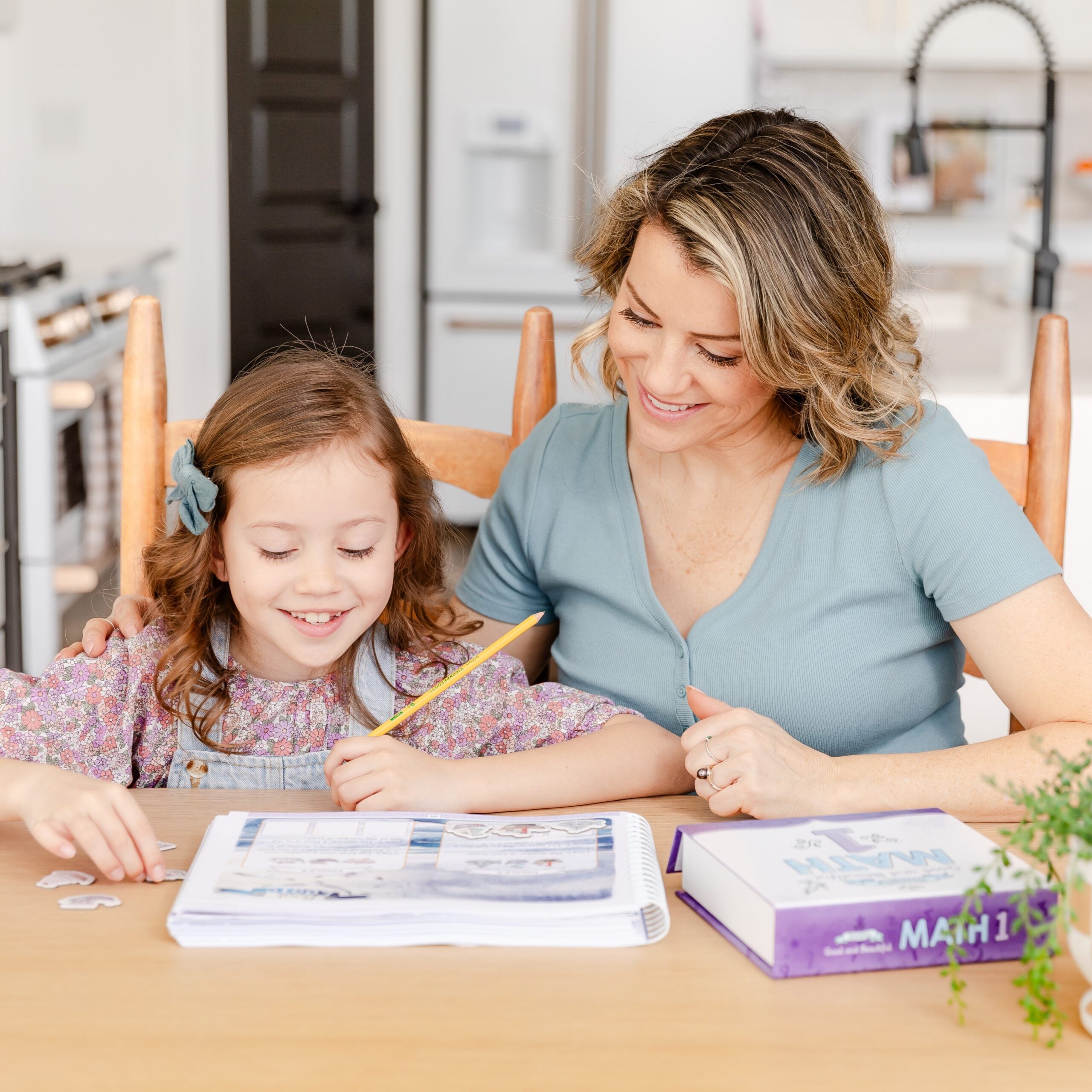 Photograph of Mother and Daughter Working on Homeschool Math for Grade 1